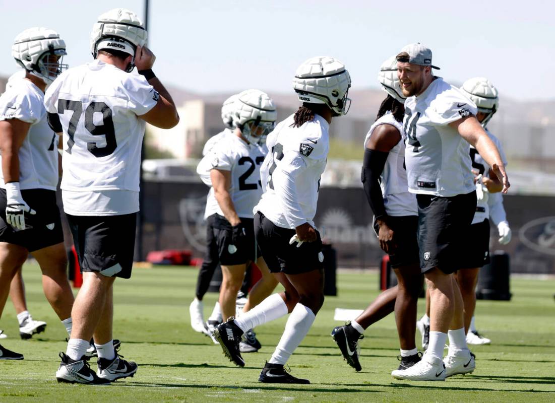 Raiders guard Ben Brown (79) wide receiver Jakobi Meyers (16) and offensive tackle Kolton Mille ...