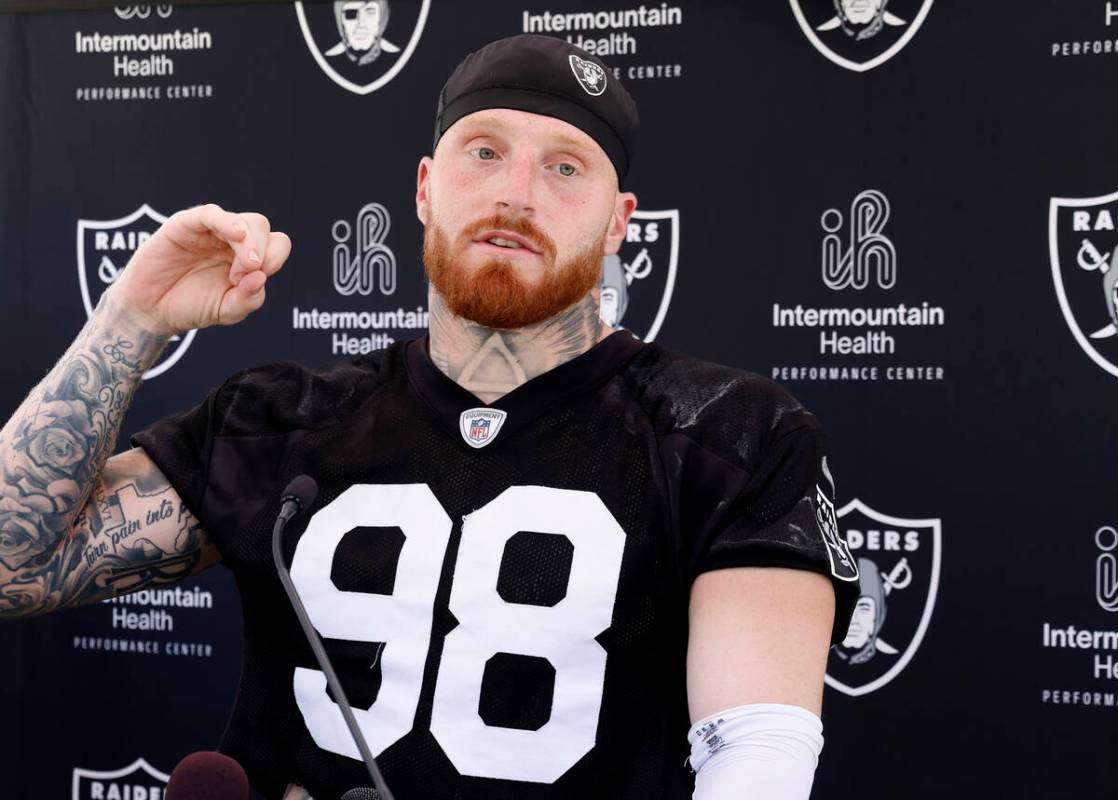 Raiders defensive end Maxx Crosby (98) addresses the media after an NFL football practice at th ...