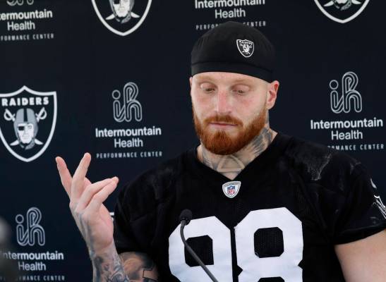 Raiders defensive end Maxx Crosby (98) pauses as he addresses the media after an NFL football p ...