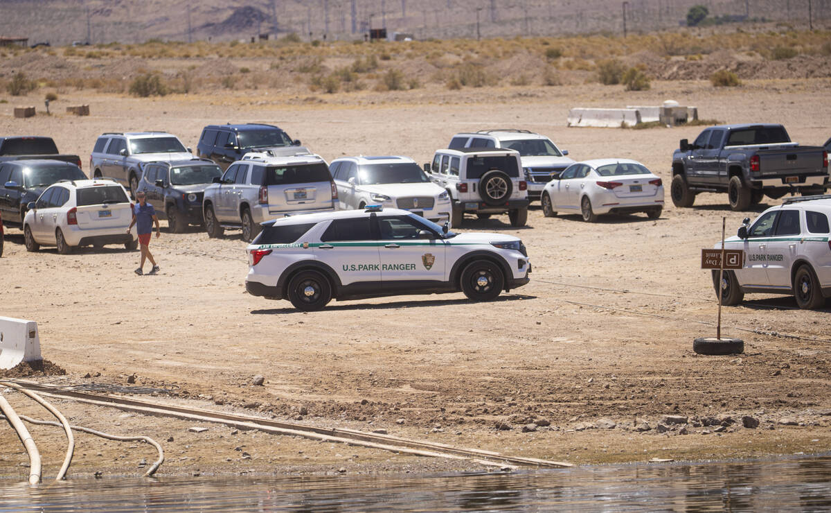 A Lake Mead National Recreation Area park ranger drives by at the Las Vegas Boat Harbor, where ...