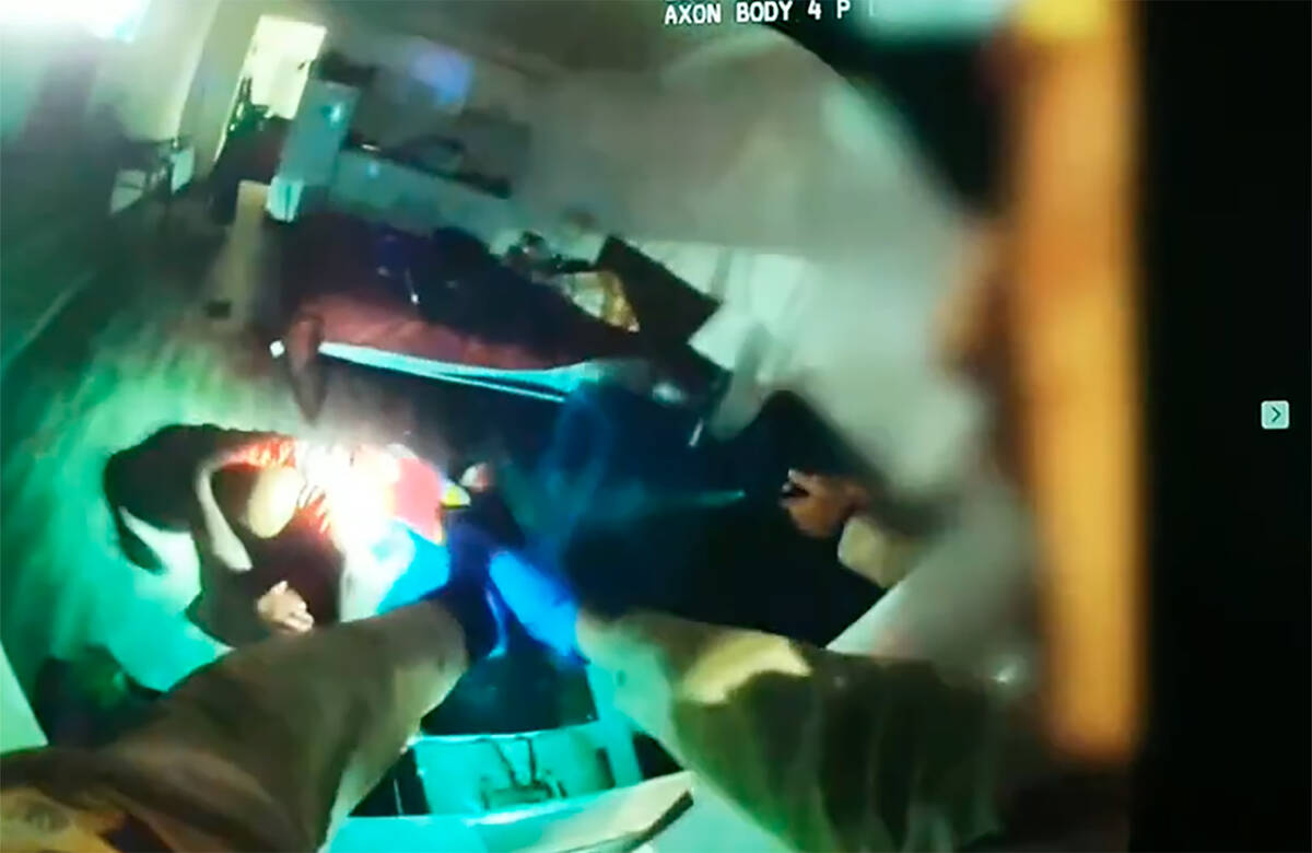 Video from an officer-worn camera shows Maurice Smith attacking a woman before he was shot by M ...