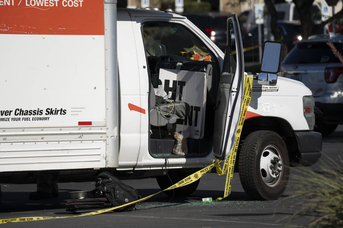 Las Vegas police investigate the scene where they found the bodies of several animals inside a ...