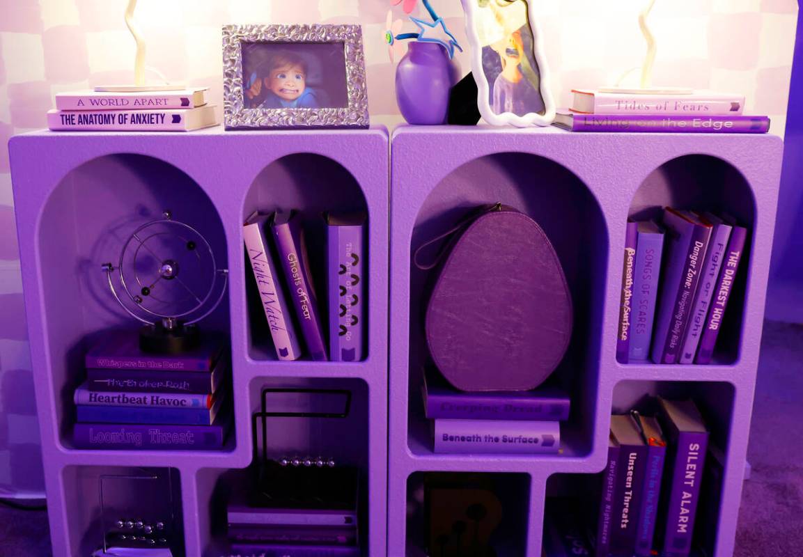 Books on fear are displayed inside a den with the theme of Fear at an "Inside Out 2"- ...