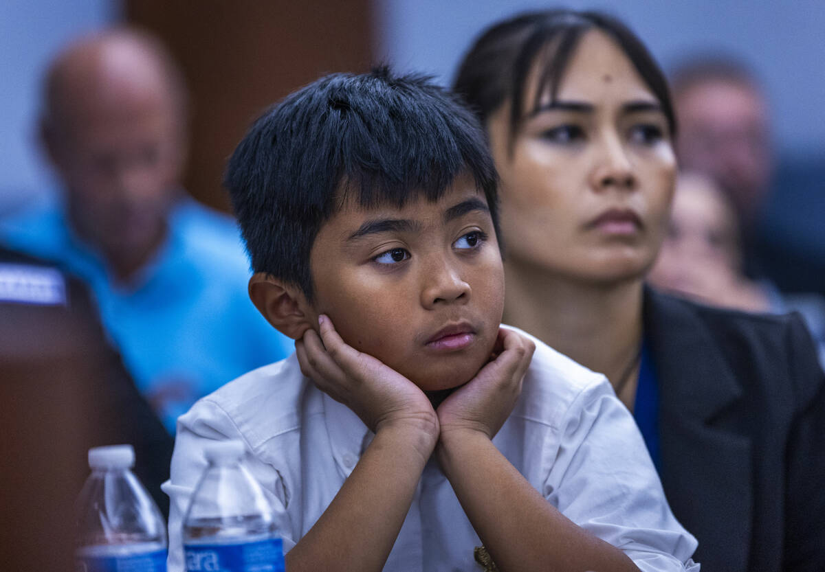 Aries Felix and his mother Arlene Felix listen to victim statements during the sentencing for J ...