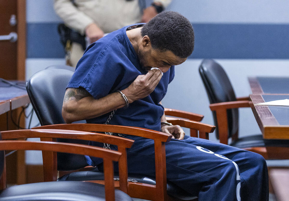 Jemarcus Williams wipes away a tear after listening to family members of the two Nevada Highway ...