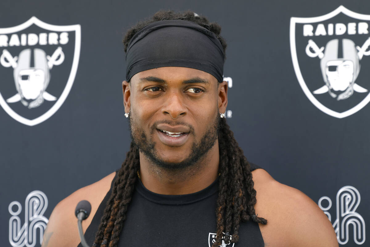 Raiders wide receiver Davante Adams addresses the media after an NFL football practice at the I ...