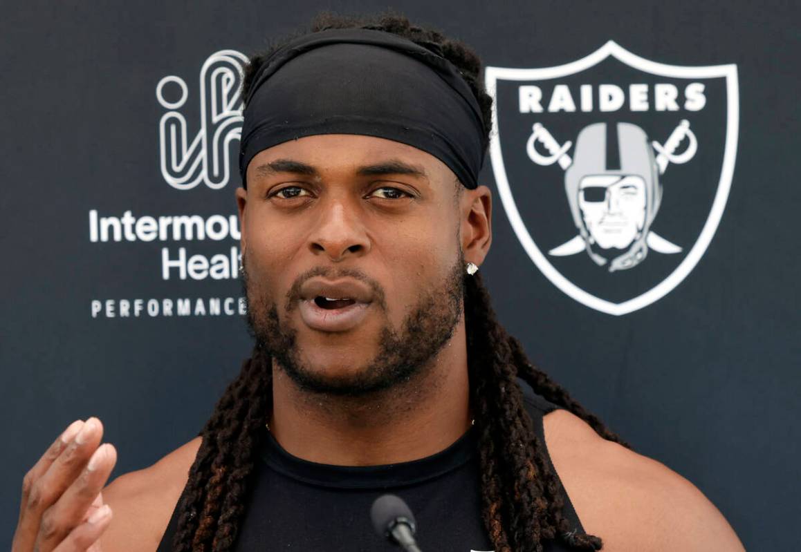 Raiders wide receiver Davante Adams addresses the media after an NFL football practice at the I ...