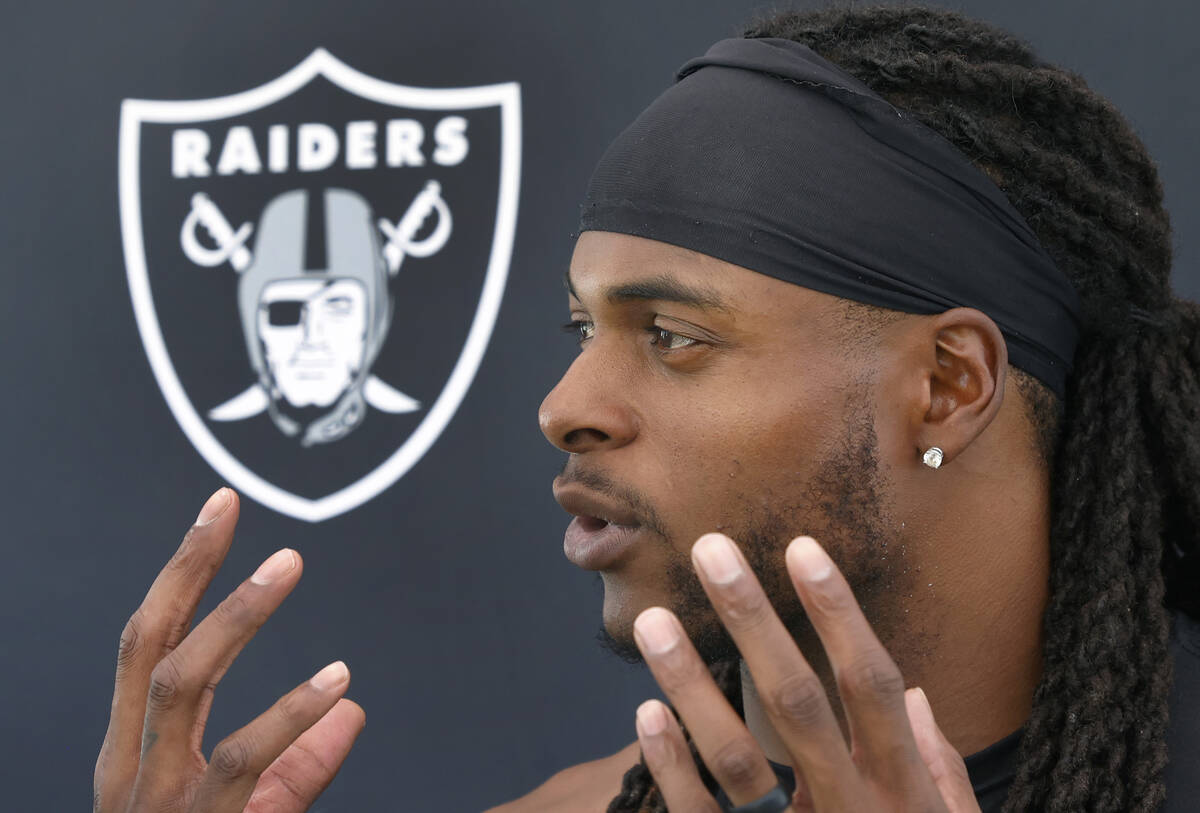 Raiders wide receiver Davante Adams addresses the media after an NFL football practice at the I ...