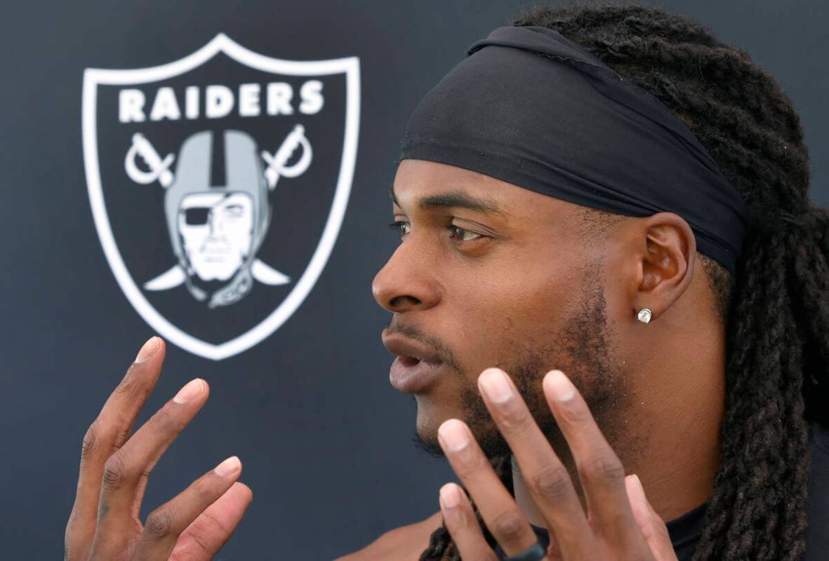 Raiders wide receiver Davante Adams addresses the media after an NFL football practice at the I ...