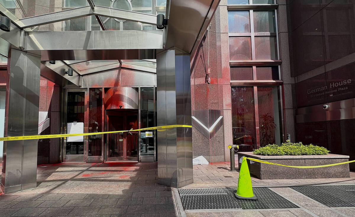 Red paint covers portions of the entrance to the German consulate building, Wednesday, June 12, ...