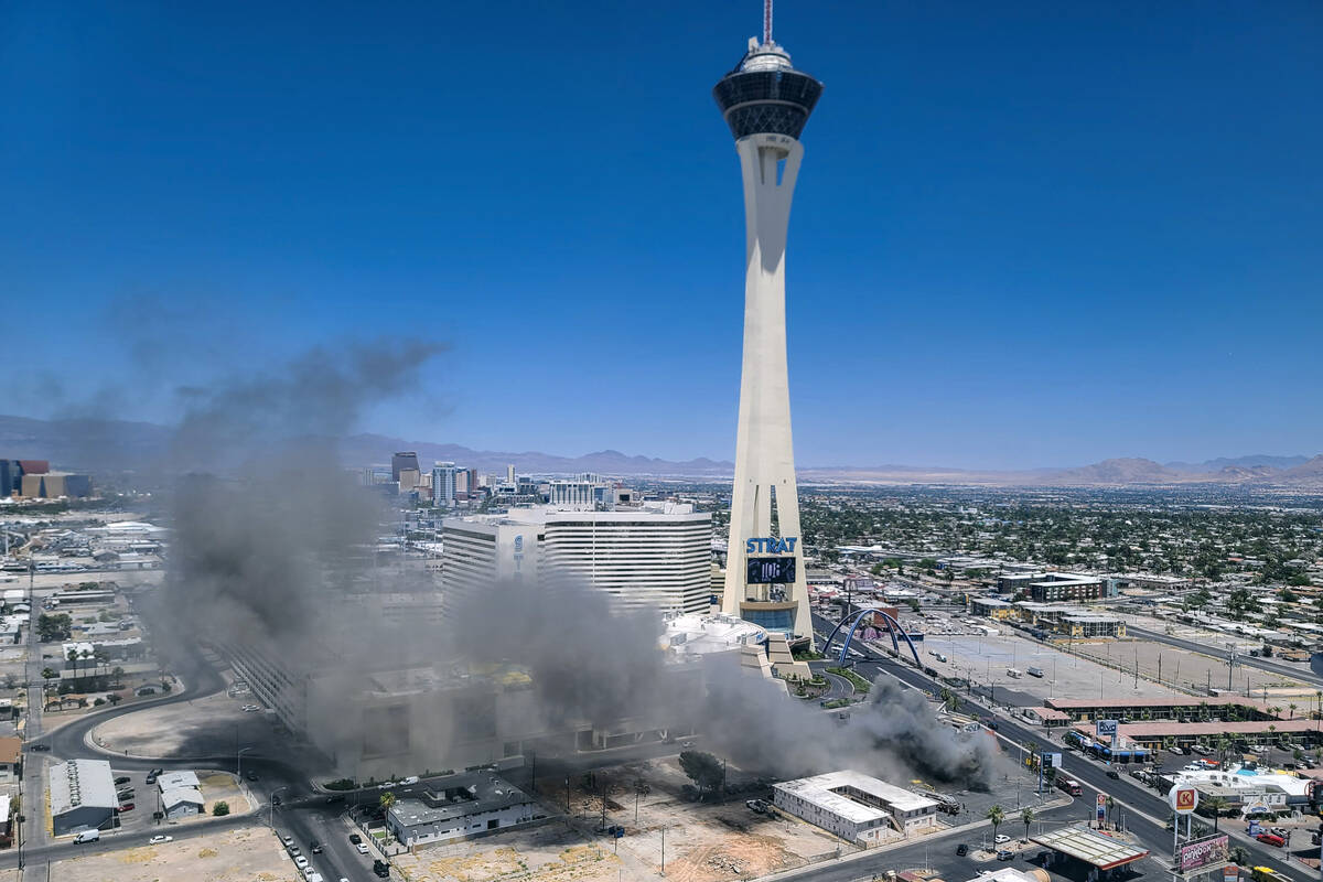 Smoke rises from a building fire on the Strip at the shuttered M&M Soul Food Cafe south of the ...