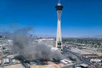 Smoke rises from a building fire on the Strip at the shuttered M&M Soul Food Cafe south of the ...