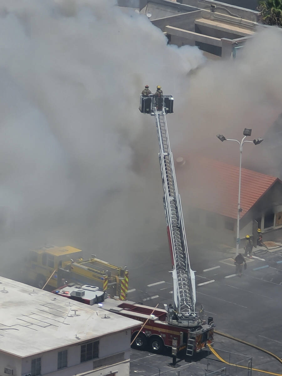 An aerial Las Vegas Fire Department unit works on a fire at the shuttered M&M Soul Food Cafe ju ...