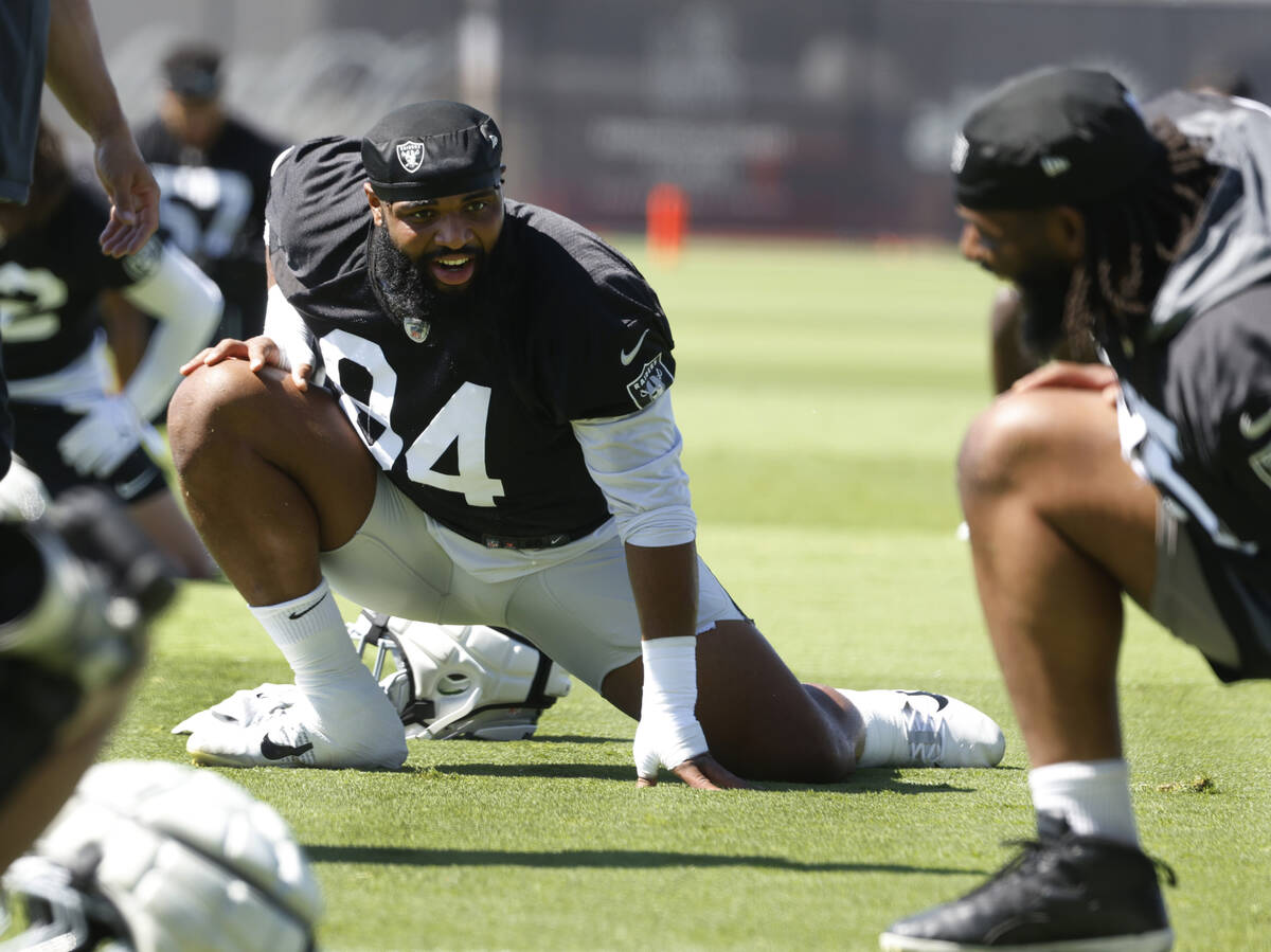 Raiders defensive tackle Christian Wilkins (94) stretches during an NFL football practice at th ...