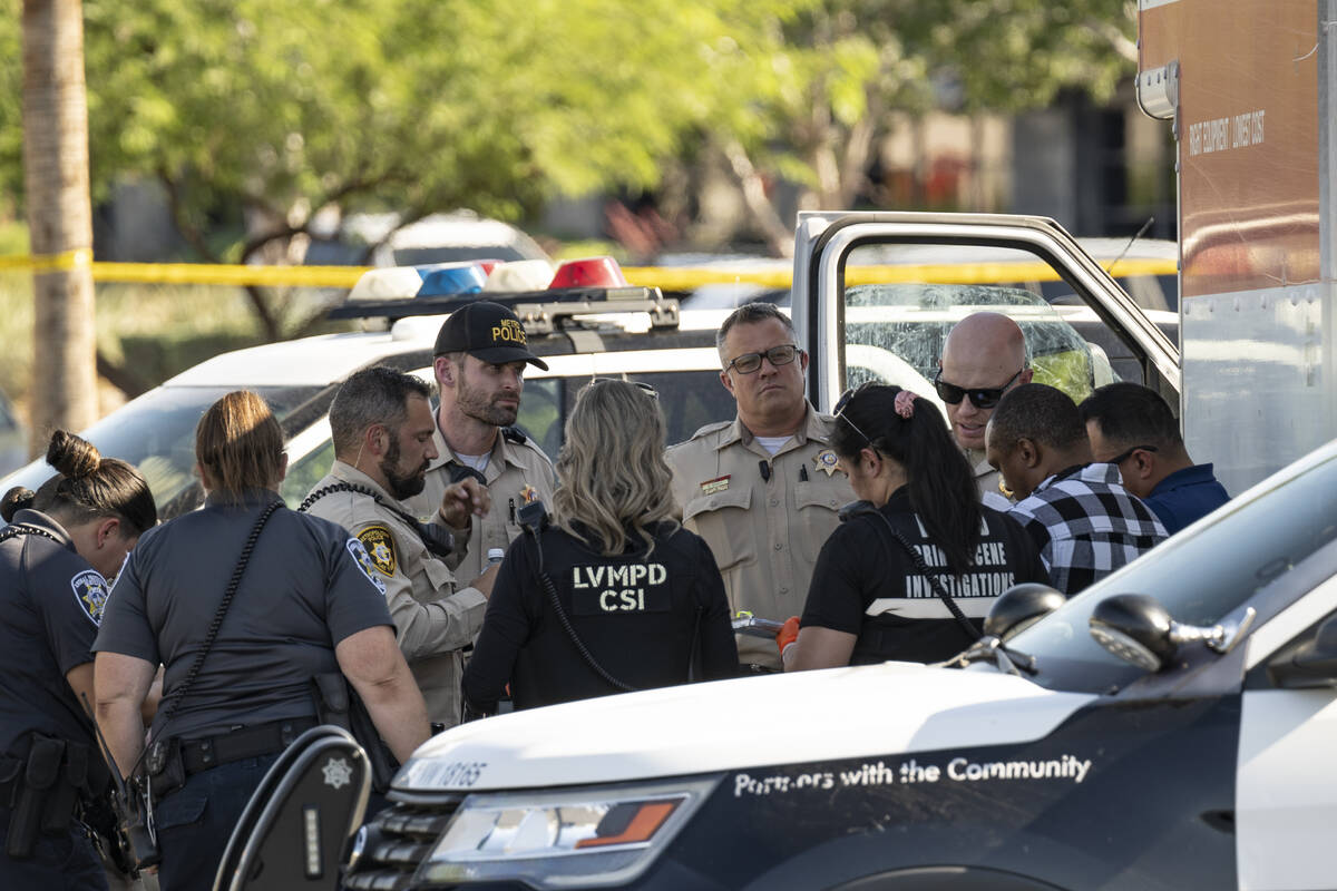 Las Vegas police investigate the scene where they found the bodies of several animals inside a ...