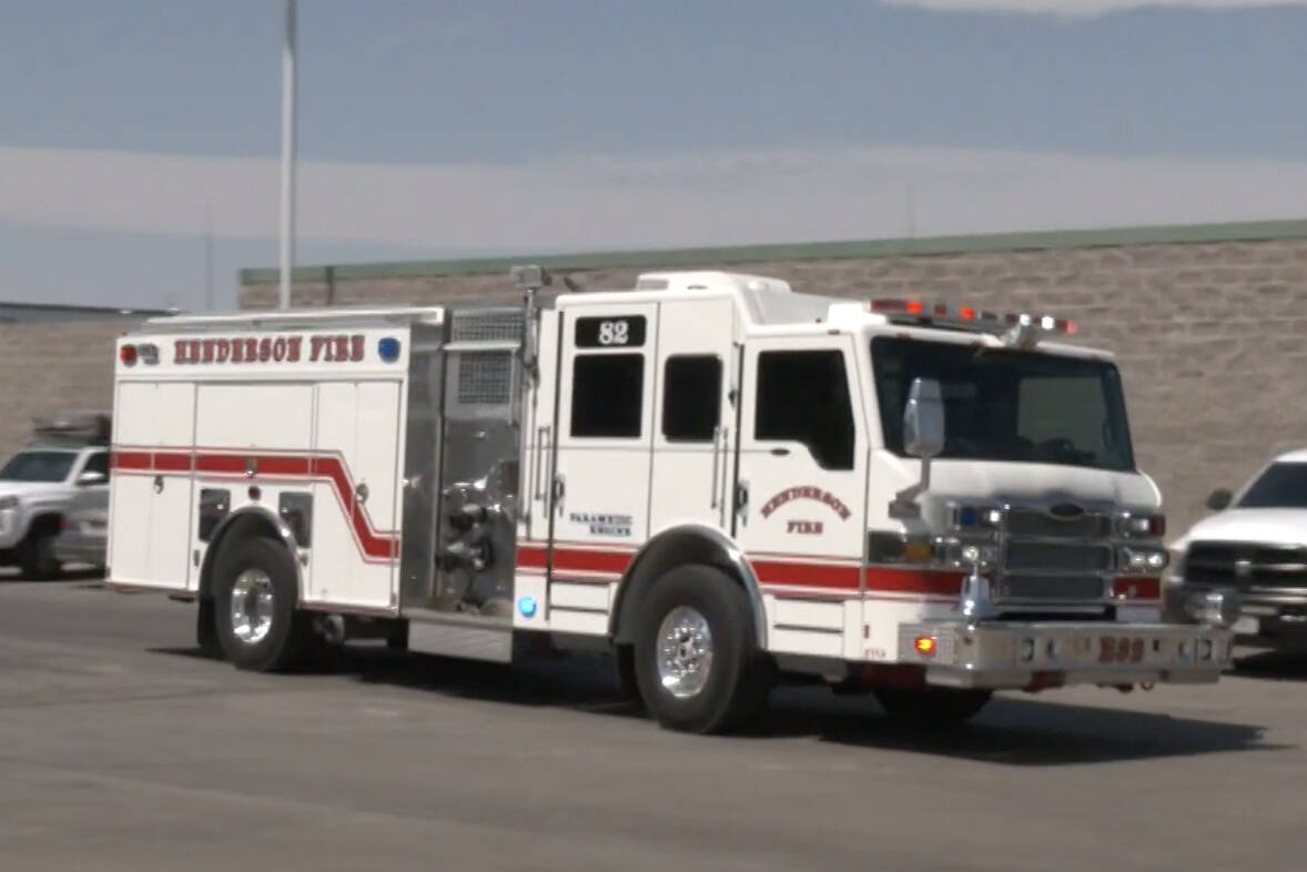 A Henderson Fire Department truck participates in a demonstration of rescuing a child from a ho ...