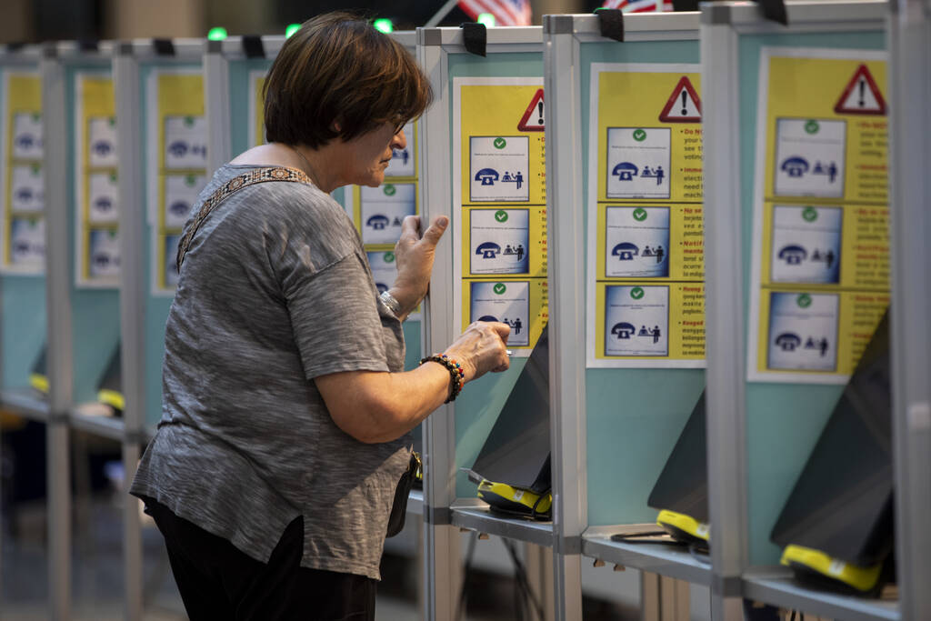 A voter casts their ballot during the Nevada Primary Day Elections on Tuesday, June 11, 2024, a ...