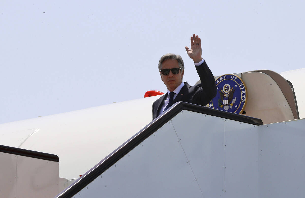 US Secretary of State Antony Blinken disembarks from an airplane as he arrives in Doha, Qatar, ...