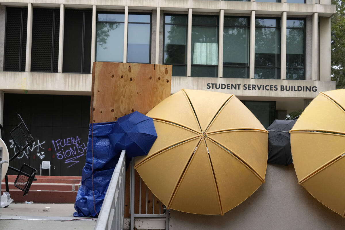 A barricade and graffiti are seen left by pro-Palestinian protesters at the Student Services Bu ...