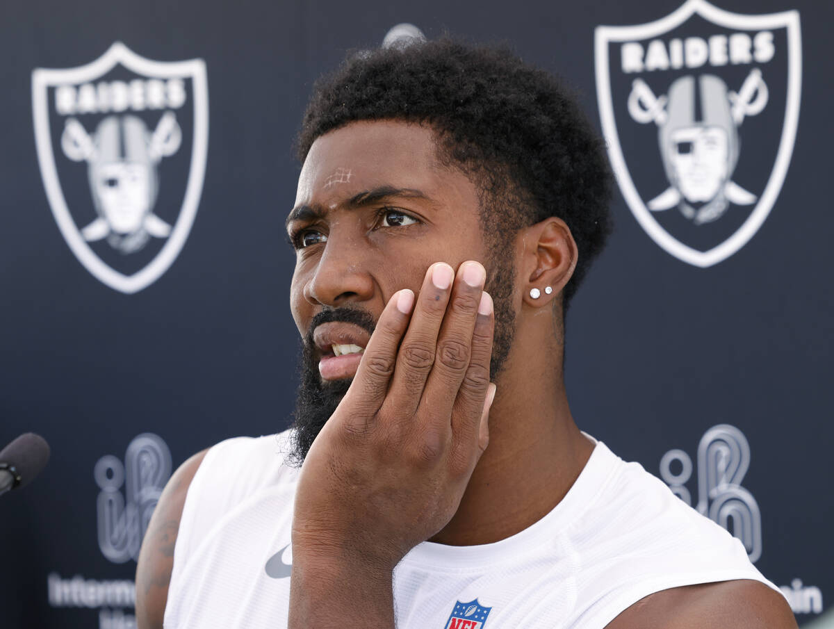 Raiders cornerback Nate Hobbs listens to reporters questions as he addresses the media after an ...