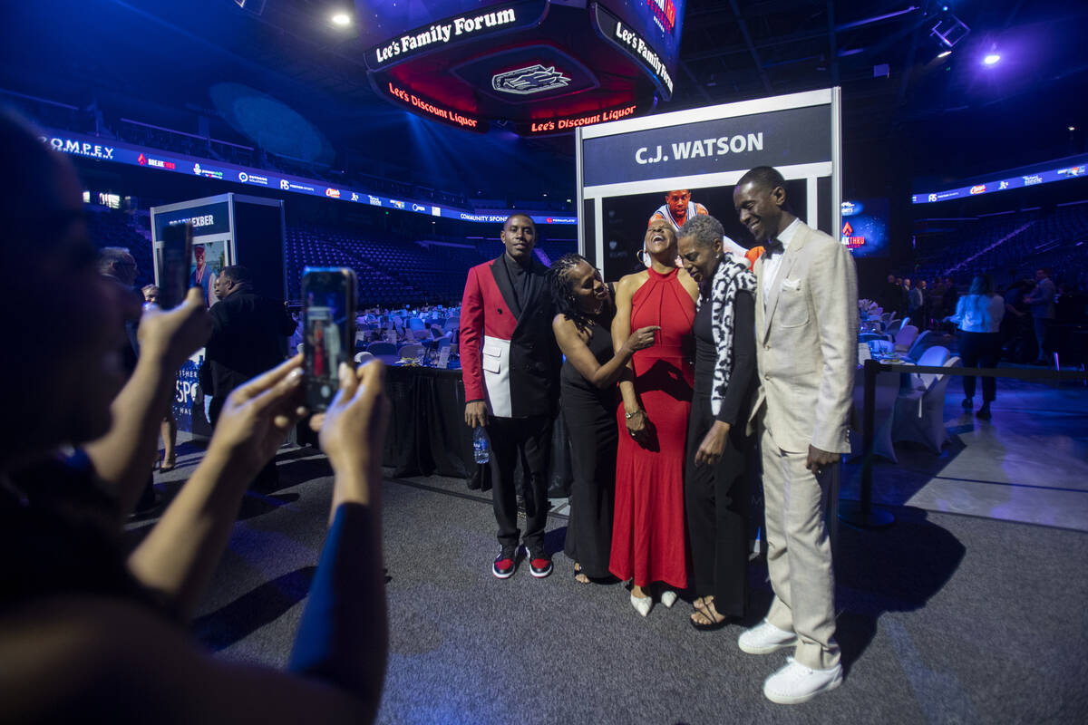 C.J. Watson, left, and members of his family prepare to take a group photograph during the Sout ...