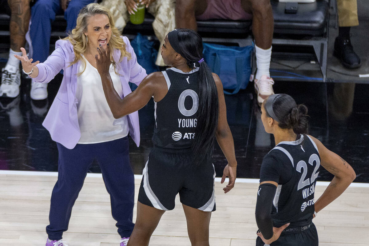 Aces head coach Becky Hammon is unhappy with guard Jackie Young (0) as they face the New York L ...