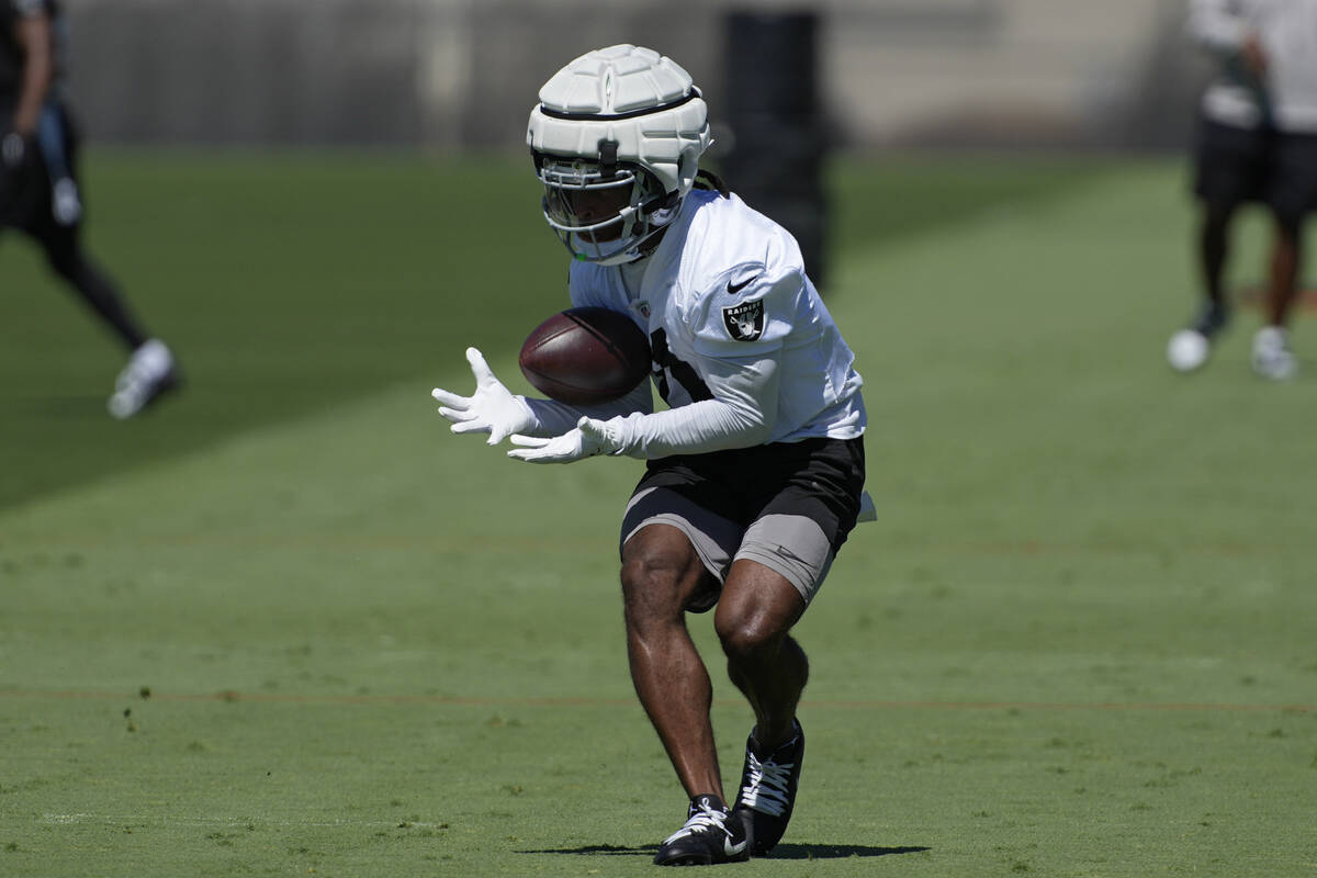 Las Vegas Raiders wide receiver Tre Tucker (11) catches a pass during an NFL football practice ...