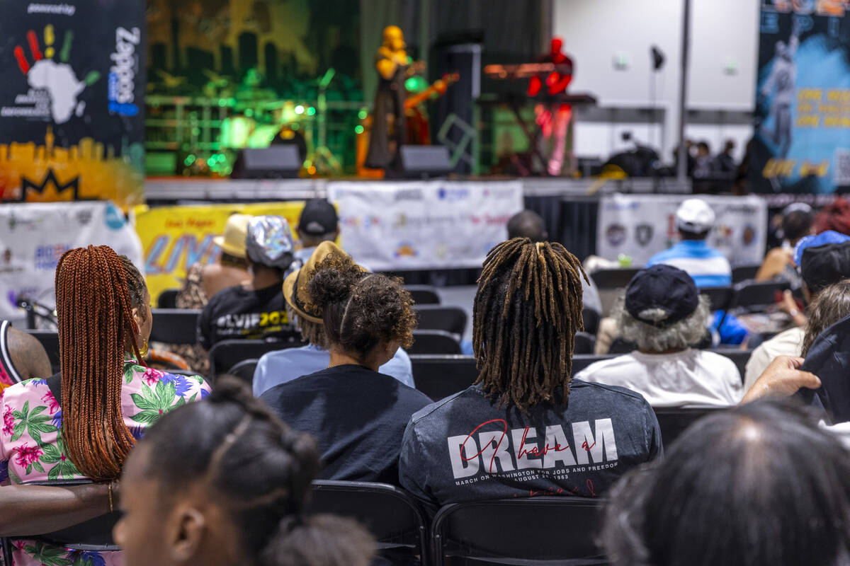Attendees enjoy a live performance during the 23rd annual Las Vegas Juneteenth Festival in The ...