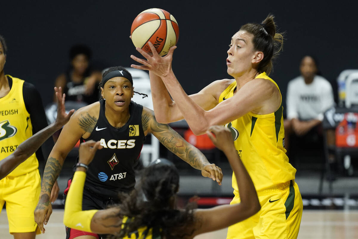 Seattle Storm forward Breanna Stewart (30) grabs a rebound away from Las Vegas Aces forward Emm ...