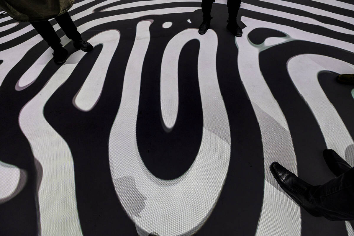 Projections of black and white lines cover the floor at Electric Playhouse, a new high-tech soc ...