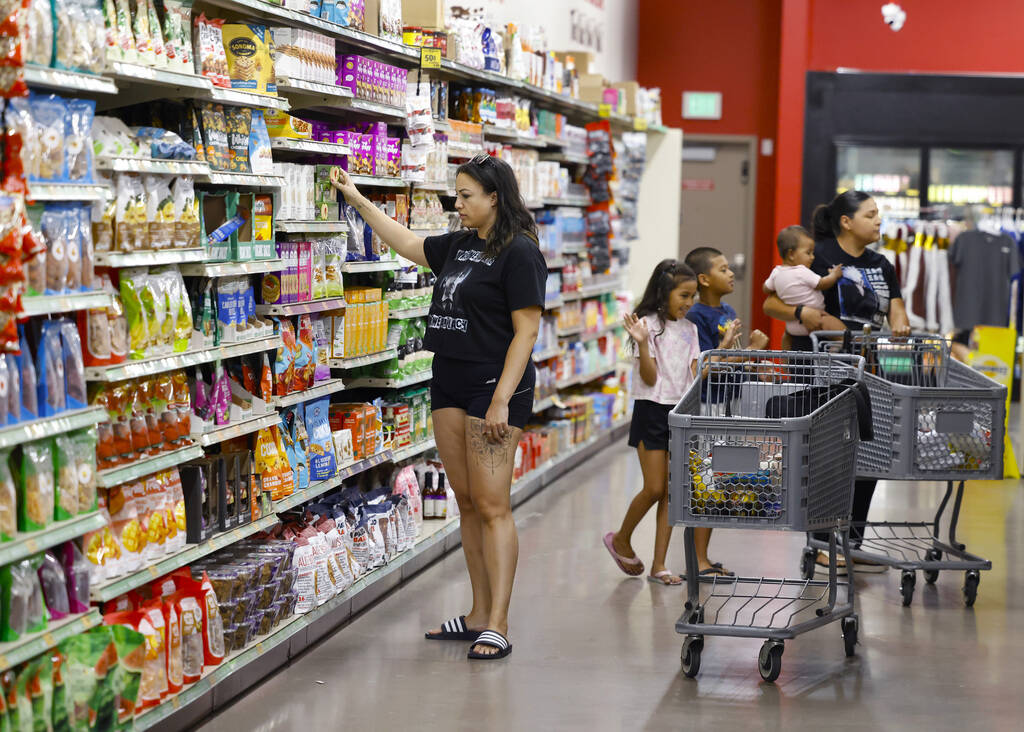 Shoppers, including Melody Jones of Las Vegas, left, shop at Grocery Outlet Bargain Market, on ...