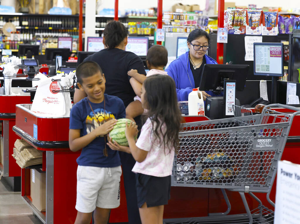 Heather Rodriguez, right, helps shoppers to checkout at Grocery Outlet Bargain Market, on Wedne ...