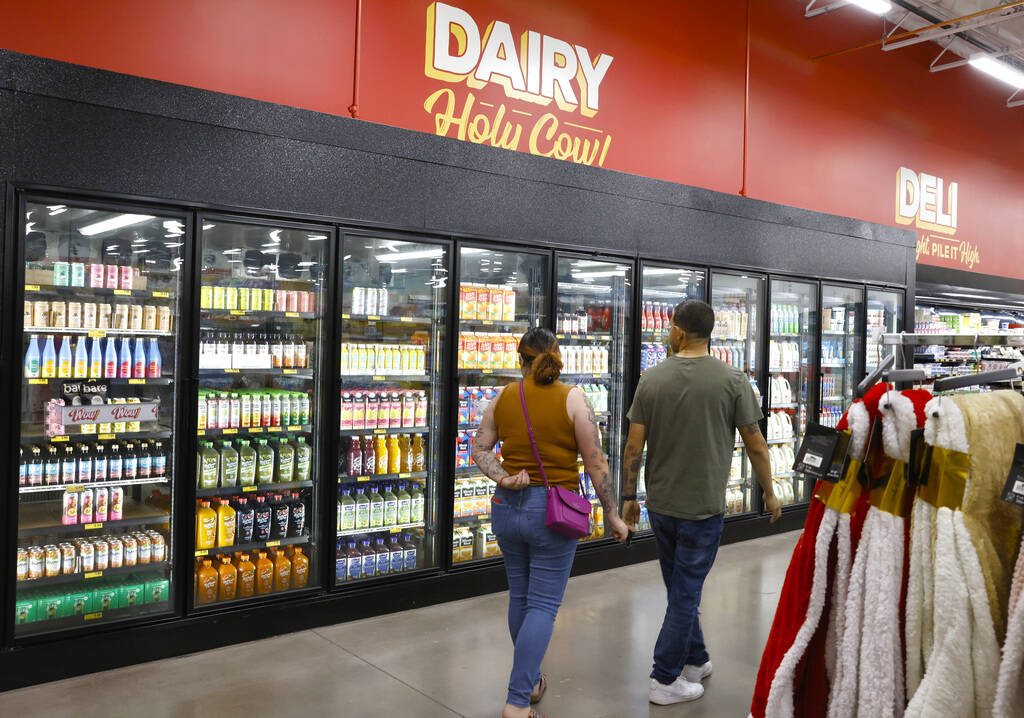 Shoppers navigate through the dairy aisle at Grocery Outlet Bargain Market, on Wednesday, June ...