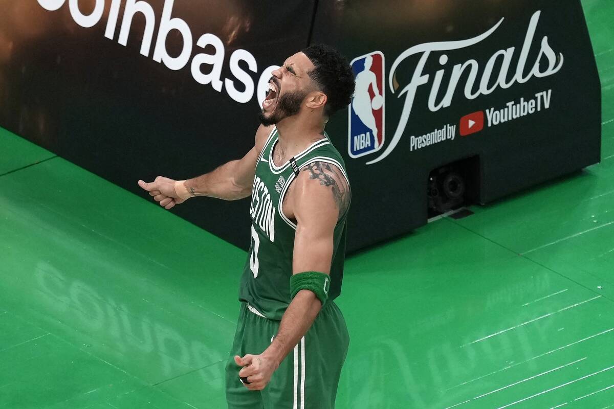 Boston Celtics' Jayson Tatum celebrates after scoring during the first half of Game 5 of the NB ...