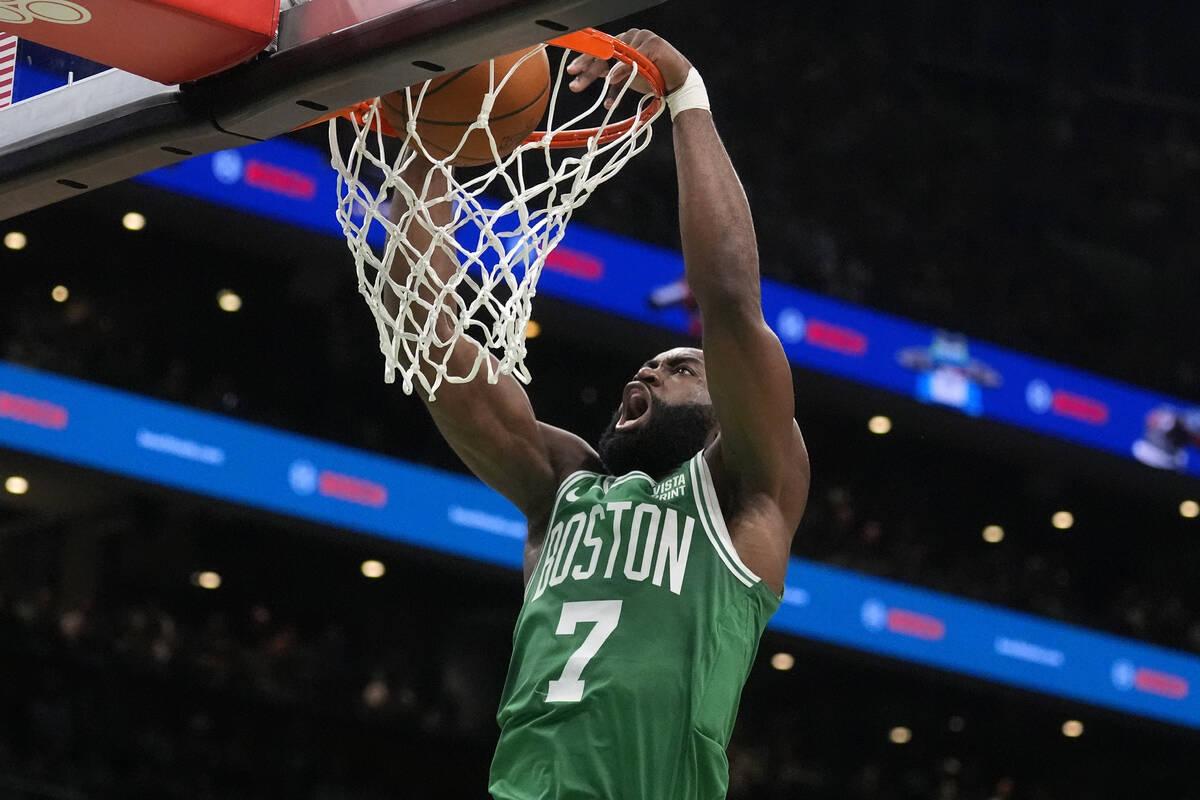 Boston Celtics guard Jaylen Brown dunks the ball during the first half of Game 5 of the NBA bas ...