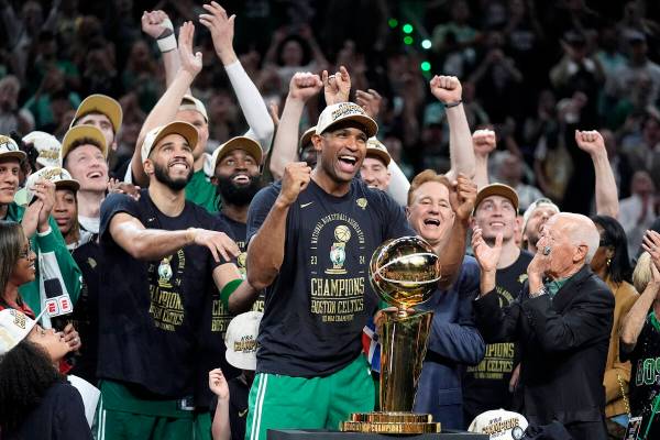 Boston Celtics center Al Horford, center, and forward Jayson Tatum, front center left, celebrat ...