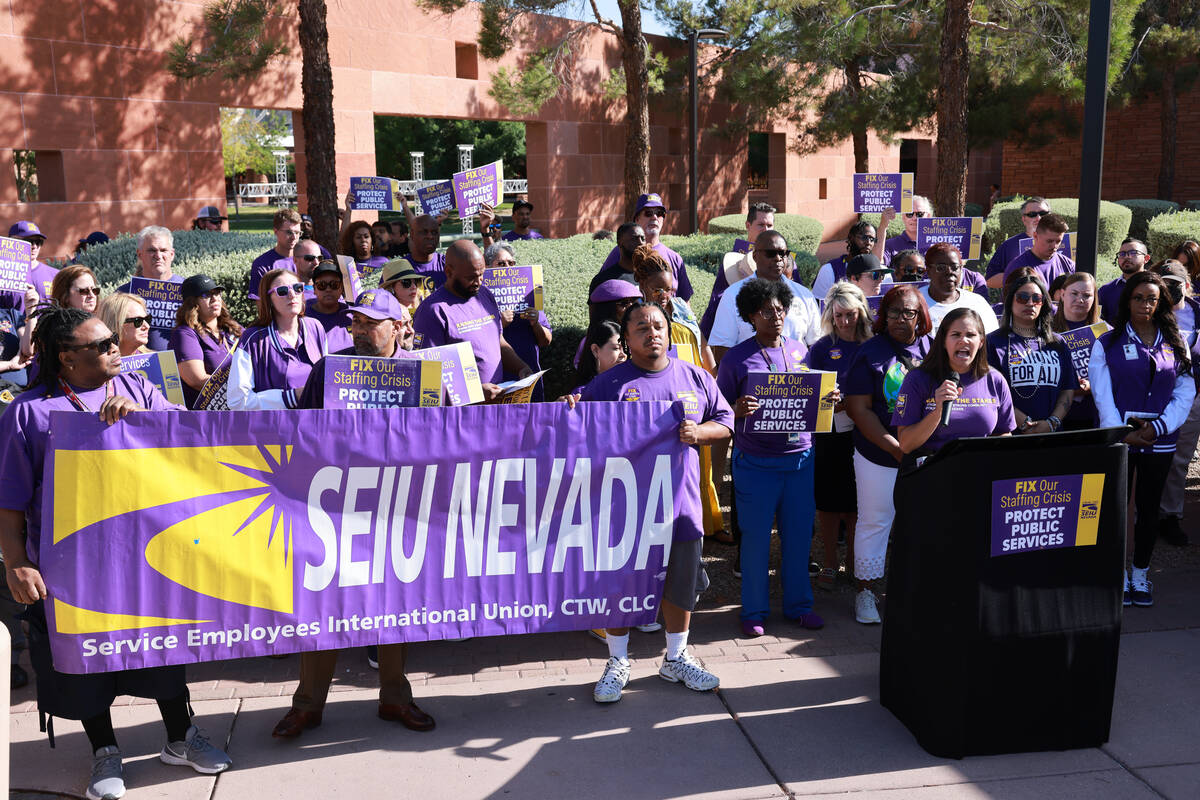 Yaritza Trevino speaks as Clark County employees rally outside the Clark County Government Cent ...