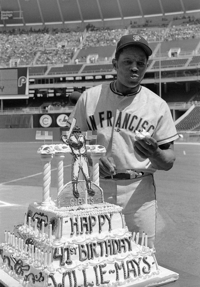 FILE - San Francisco Giants centerfielder Willie Mays eats part of a cake presented to him at h ...