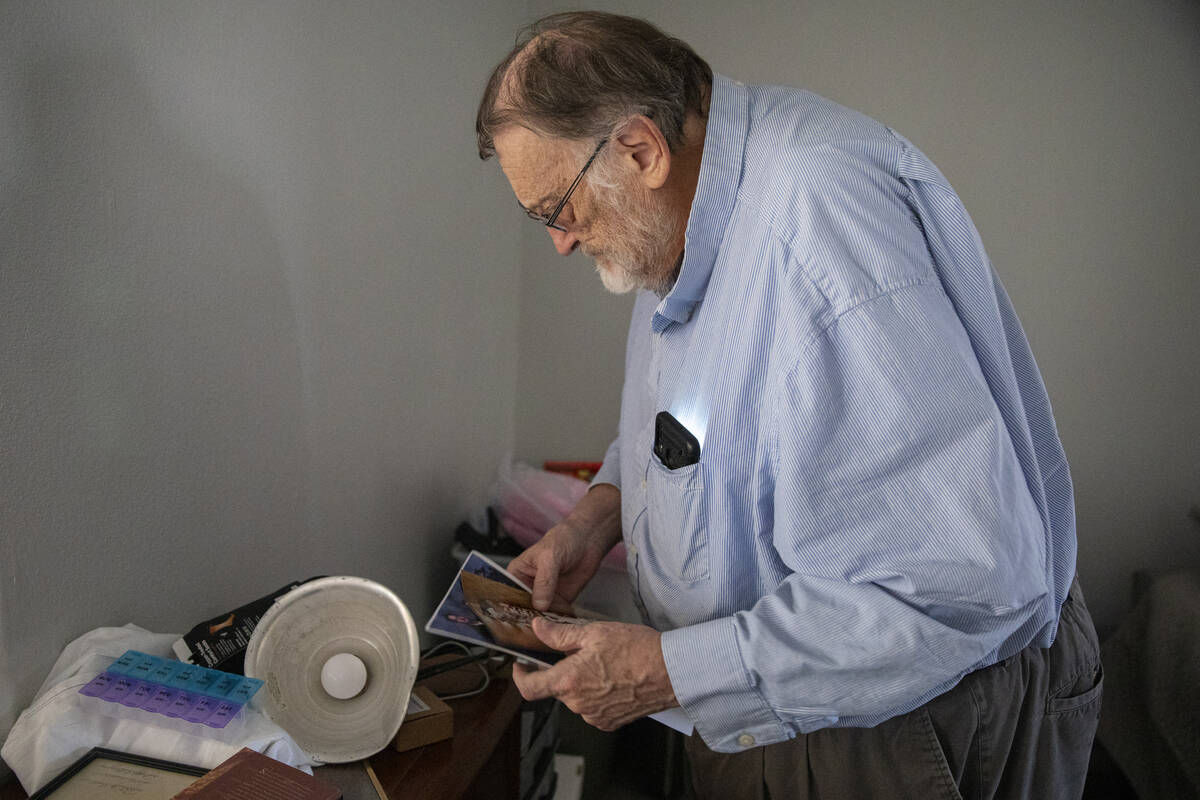 James Belnap looks through old photographs at his home on Monday, June 24, 2024, in Mesquite, N ...