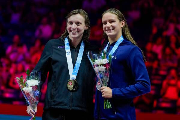 Katie Ledecky and Katie Grimes celerate after the women's 1,500-meter freestyle finals Wednesda ...