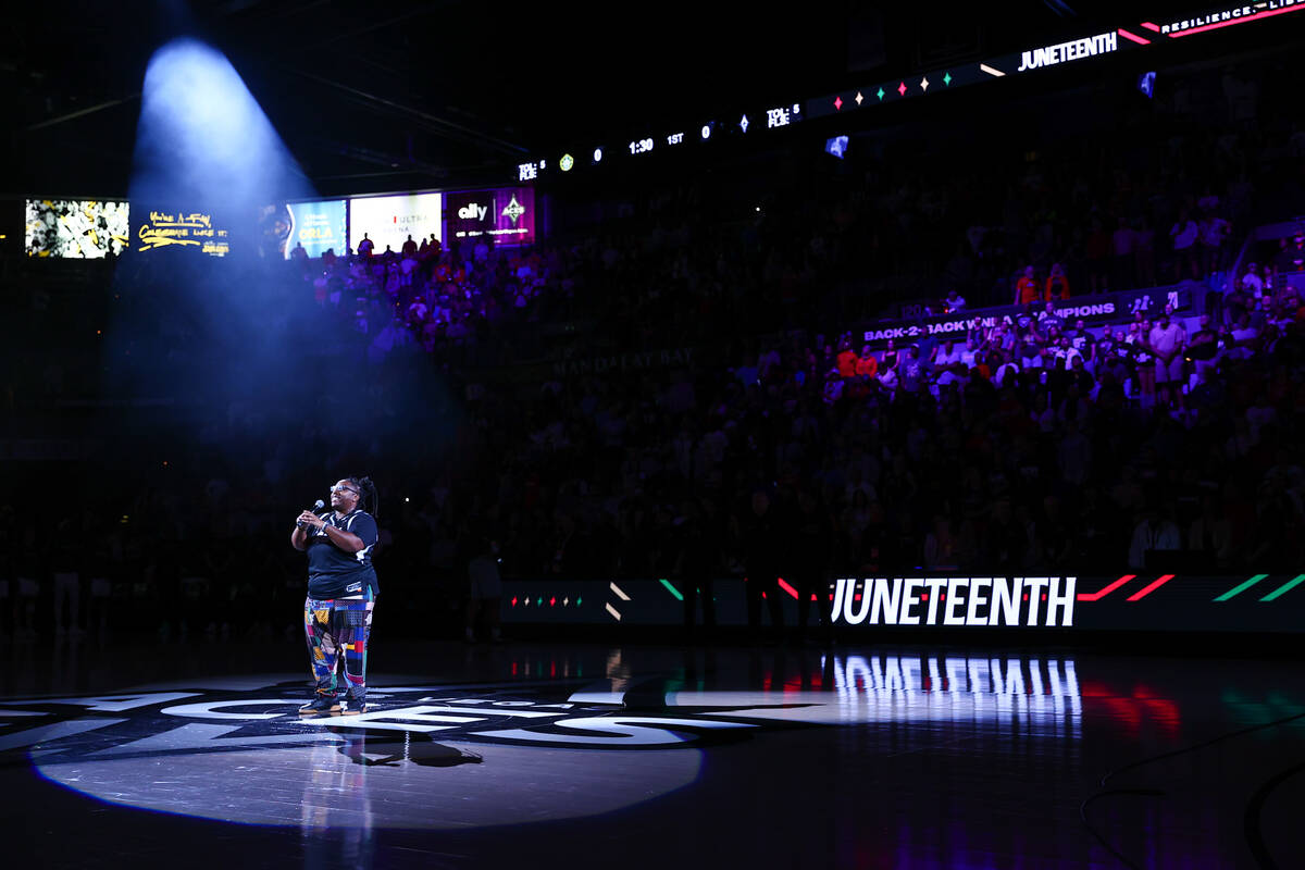 Jazzy the Healer sings on the Juneteenth holiday before a WNBA basketball game between the Las ...
