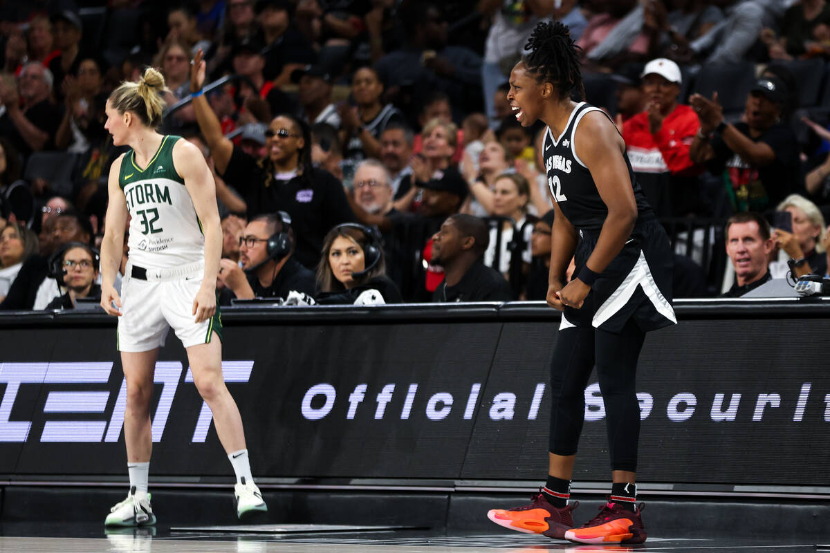 Las Vegas Aces guard Chelsea Gray (12) celebrates after scoring while Seattle Storm guard Sami ...