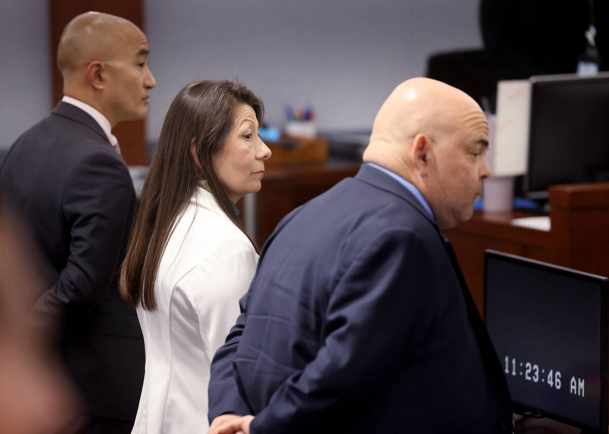 Pamela Bordeaux, 60, left, stands as the jury returns to the courtroom with a verdict in her mu ...