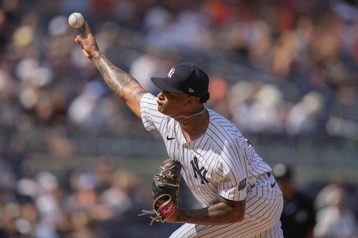New York Yankees' Luis Gil pitches during the first inning of a baseball game against the Balti ...