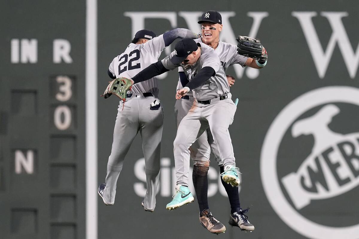 New York Yankees outfielders Juan Soto, Alex Verdugo and Aaron Judge, from left, celebrate afte ...