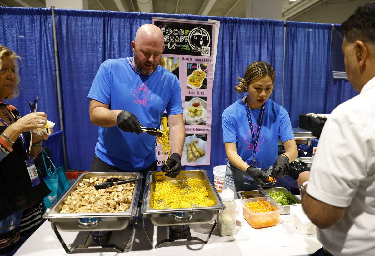 Judy Le, right, owner of Food Therapy LV, and her partner Stephen Allen serve sample of Asian f ...