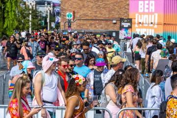 A crowd snakes its way about the general admission gates on their way to the first night of Lif ...