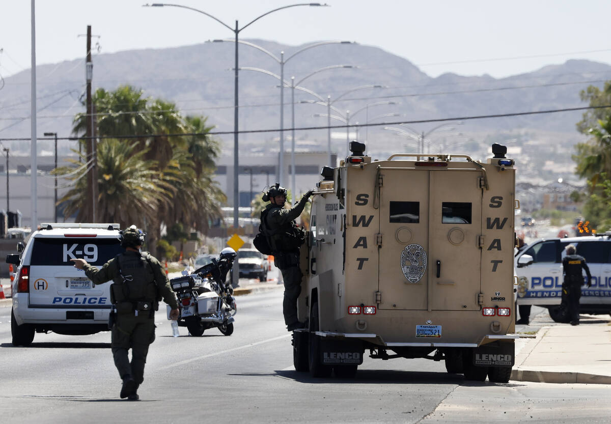 The Henderson Police Department SWAT team officers arrive where a shooting that involved police ...