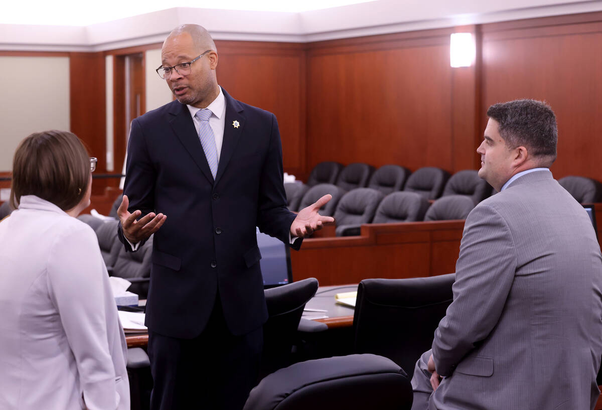 Attorney General Aaron Ford, center, meets with Chief Deputy Attorney General Alissa Engler and ...