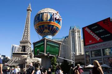 Tourists walk past Paris Las Vegas on Friday, Oct. 23, 2020, in Las Vegas. (Bizuayehu Tesfaye/L ...